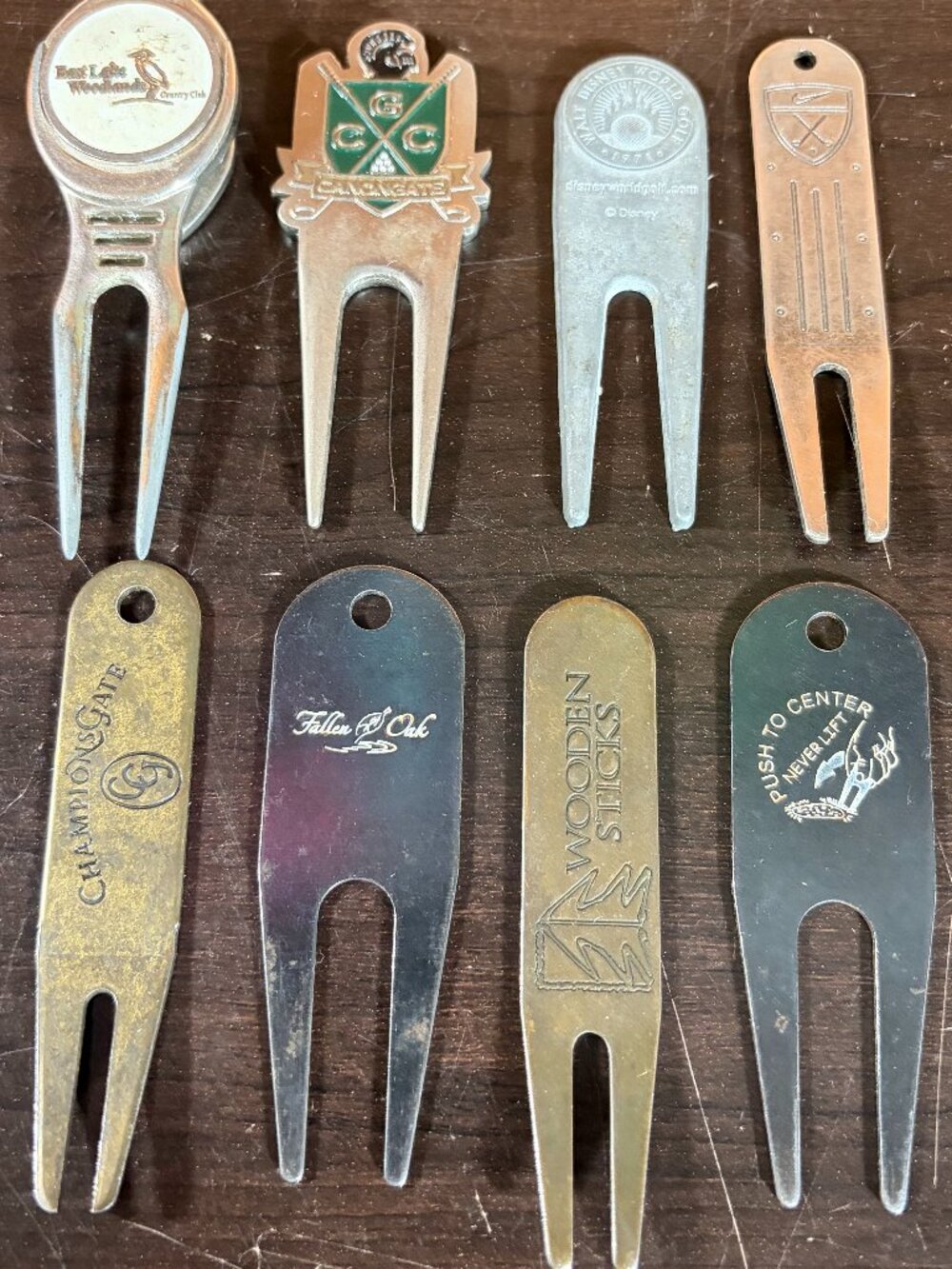 Lot of 8 Assorted Golf Divot Repair Tools - Nike/Canongate/Disney/Wooden Sticks